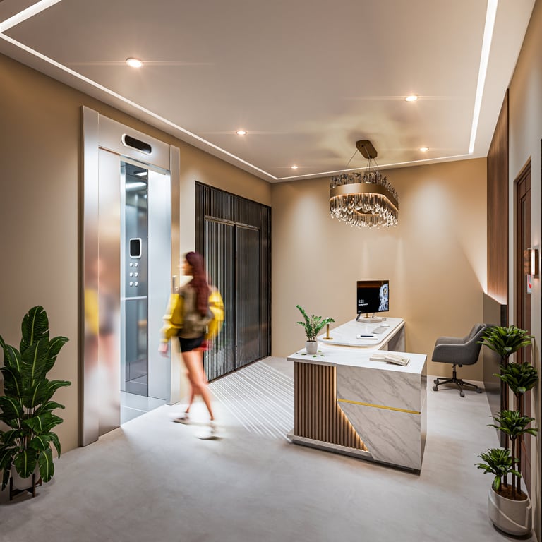 Modern apartment lobby with woman in yellow jacket near elevator, marble desk, potted plants, and contemporary lighting fixtures
