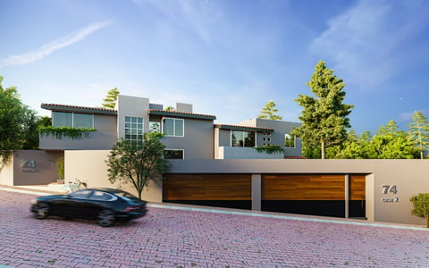 Modern two-story house with gray facade, large windows, and double garage on brick driveway with landscaping