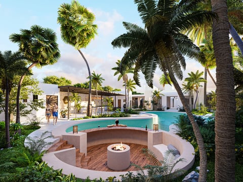 Luxury resort with sunken fire pit, swimming pool, and modern white buildings surrounded by tall palm trees