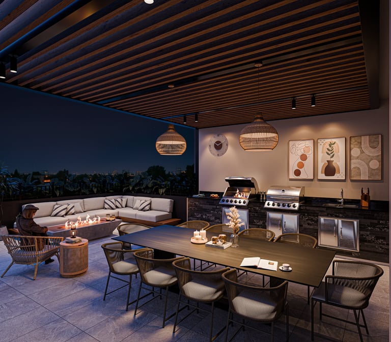 Modern rooftop terrace with dining table, lounge seating, kitchen area, and illuminated pendant lights at dusk